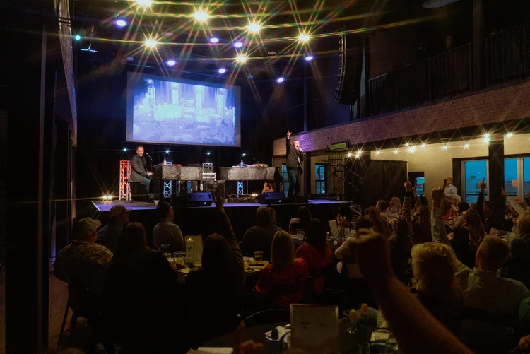 Eclipse Venue interior during a live show, stage lit and crowd watching